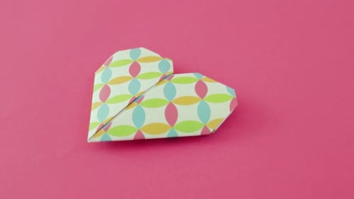 Colorful Paper Heart Shape on Pink Background