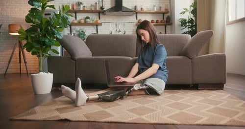 Young Woman Using Laptop in Modern Home