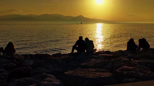 Loving Couple Looking At The Sunset
