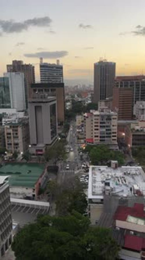 Aerial View of Caracas Cityscape at Sunset - Urban Traffic and Modern Skyscrapers in Venezuela