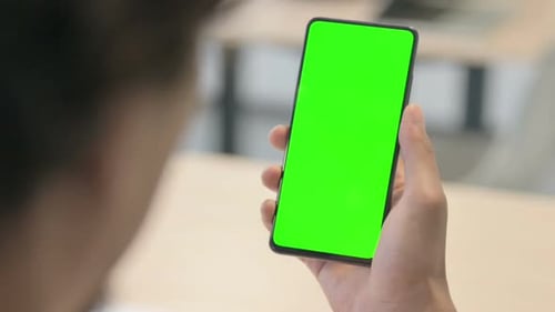 Close up of African Man Using Green Screen Smartphone