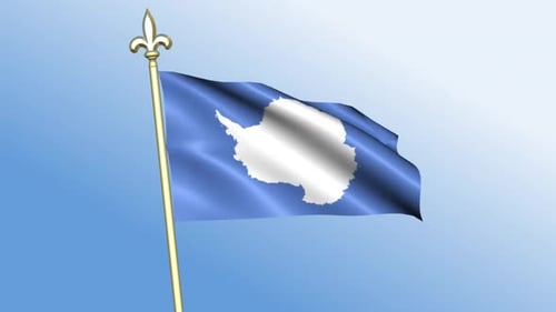 Waving Flag of Antarctica with Golden Finial Pole against Blue Sky