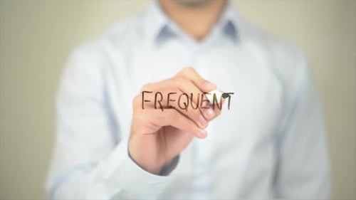 Frequent Man Writing on Transparent Screen