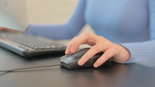 Close up of Female Hands Using Computer Mouse