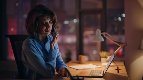 Tired Professional Talking Mobile Phone at Night Office Writing Notebook Closeup