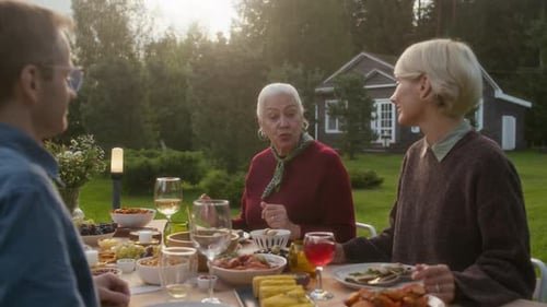 Family enjoys an outdoor meal in the garden