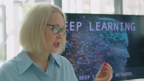 Woman Telling Audience about Deep Learning Research