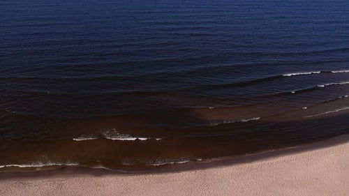 Drone Aerial View of Waves Sea Ocean Coast Beach and Dunes Dark Calm Sea Waves Nature Landscape