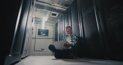Man Sitting in Server Room