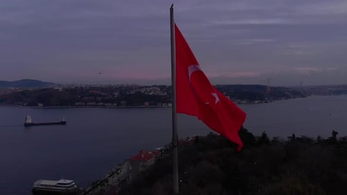 Aerial View of Flag with City and Sea