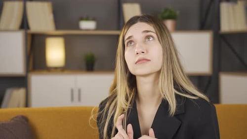 Woman Speaking and Gesturing Indoors During Daytime