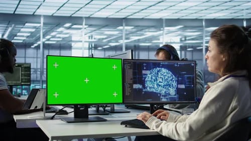 IT Support Workers in AI Data Center Coding on Green Screen Computers