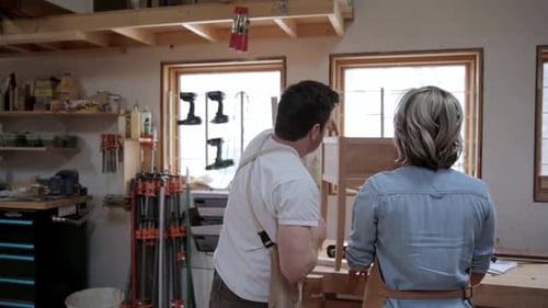 Carpenters Discussing Wood Side Table in Workshop 3539 Years