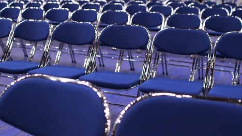 Rows of Blue Chairs in Meeting Room