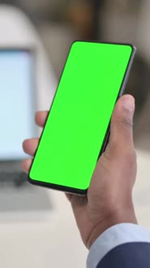 Businessman Holding Smartphone with Green Chroma Key Screen, Vertical Video