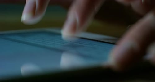Fingers Typing on a Touchscreen Tablet Device