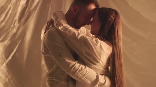 Slo Motion of Hugging Couple in Studio Turning Off Light on Background Young Boyfriend Sensual