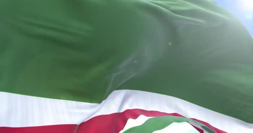 Realistic Flag Waving in Wind Against Blue Sky