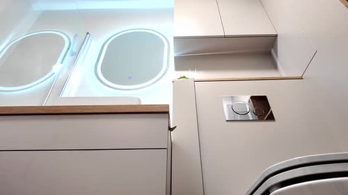 A modern bathroom with a bathtub and a shower area, practically designed