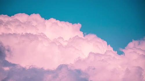 Dreamy Pink Clouds Against a Vibrant Turquoise Sky