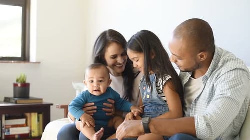 Happy Family Relaxing Together on a Bright Sofa