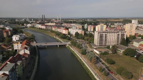 Aerial establishing shot over River Becva and industrial town Prerov