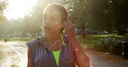 Fitness, running and listening to music with woman outdoor at park for a run