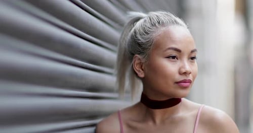 Attractive young woman with blonde hair looks