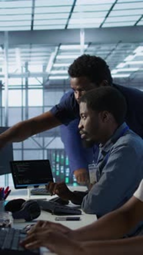 Vertical Video Manager Supervising Server Room Workers