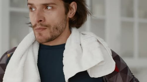 Young man resting after a workout indoors