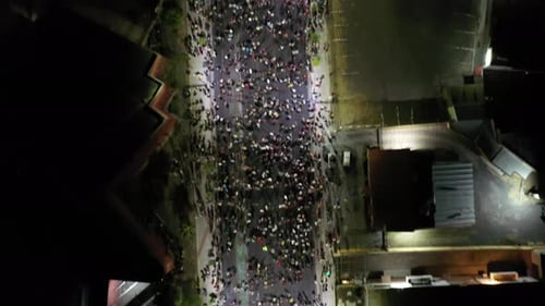 Aerial View of a Large Crowd at Night