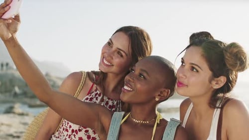 Women friends, beach selfie and summer vacation with smartphone tech for social media