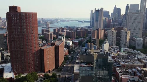 Aerial View of Manhattan New York City Highlighting the Iconic Brooklyn Bridge and East River During