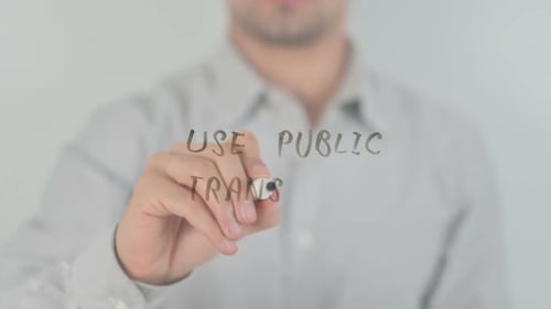 Writing Use Public Transport on Glass with Marker