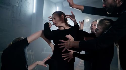 Dancers Touch and Form Woman in Studio