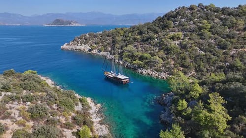 Aerial View of Boat Sailing in Blue Cove