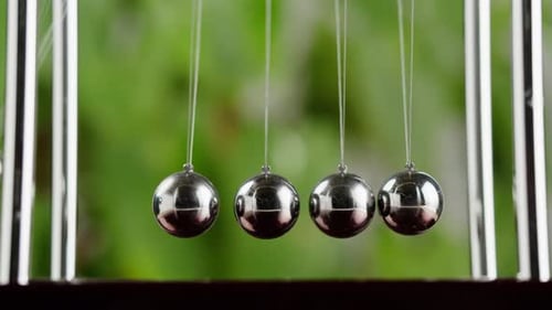 Newton's Cradle Demonstrating Conservation of Momentum