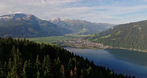 Majestic Mountains And Cloudy Skies Over Austrian Lake Town