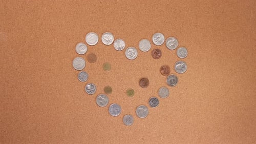 Love and Money: Coins Forming Heart Shape