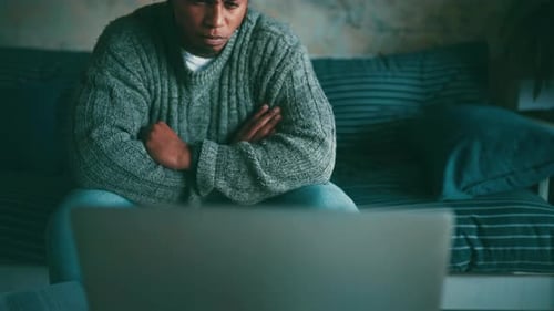 Man, laptop and streaming movie at home, funny series and comedy on technology in living room
