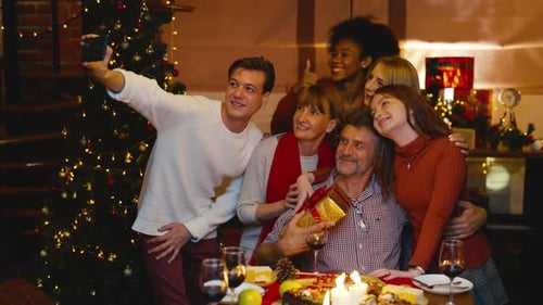 Family Celebrates Christmas Together with Selfie