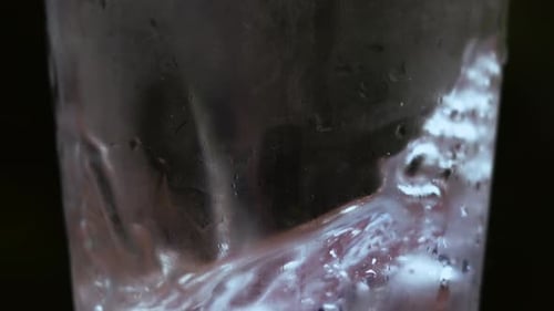 Ice Cubes Swirling in a Glass of Water