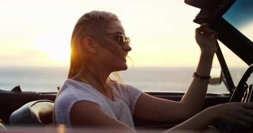 Woman, road trip and freedom at sunset at the sea in a car with drive for holiday
