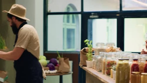 Man Buying Pasta From Small Business Owner