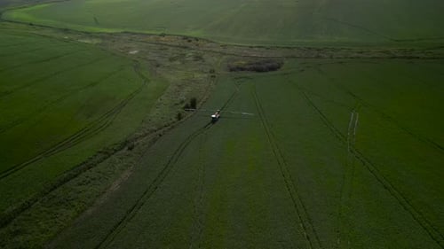 Spray Fertilize On Field With Chemicals In Agriculture Field