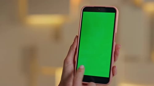 Businesswoman Hand Swiping Chroma Key Mobile Phone at Workplace Close Up