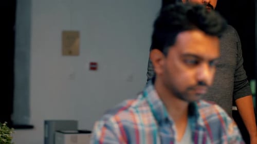 Late night collaboration young professionals working overtime in modern office