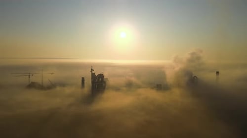 Aerial View of Cement Factory with High Concrete Plant Structure and Tower Crane at Industrial
