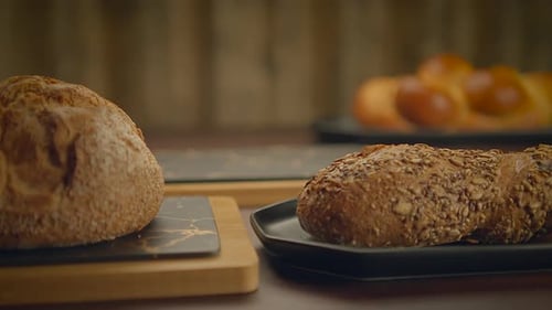 Assorted Breads and Baked Goods Displayed on Table