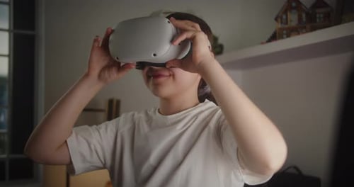Girl Uses VR Headset in Bedroom